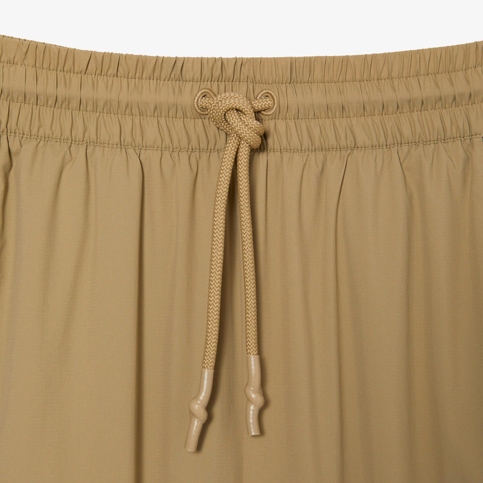 Dámske teplákové nohavice Lacoste s perforovaným efektom